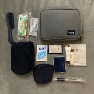New United Business First class travel pouch with its original content